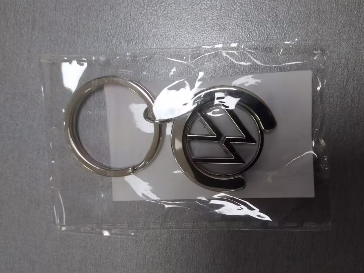 000087010BT - Brelok z żetonem; nowe logo VW [2/11]