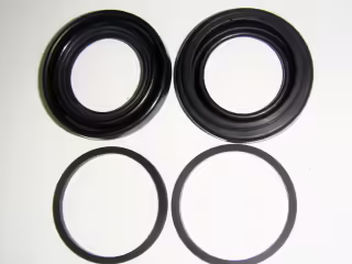 Set of gaskets for brake caliper housing